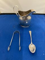 THREE HALLMARKED SILVER ITEMS TO INCLUDE A JUG, TEASPOON AND A SET OF SUGAR NIPS
