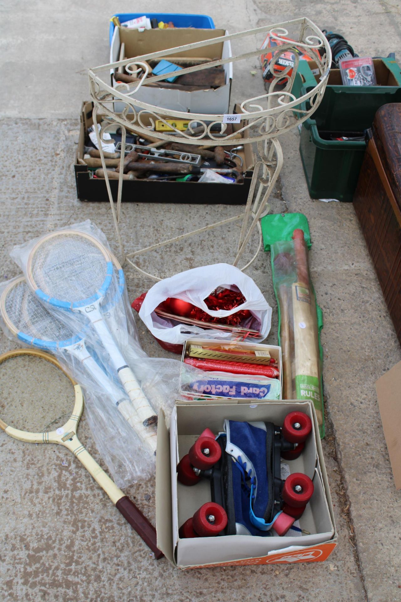 Assorted Rackets AN ASSORTMENT OF ITEMS TO INCLUDE TENNIS RACKETS, ROLLER SKATES AND A ...