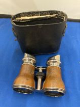 A PAIR OF VINTAGE FRENCH LEATHER WRAPPED PARIS JOCKEY CLUB BINOCULARS WITH CASE