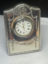 A HALLMARKED SHEFFILED SILVER R CARR ENGLAND MANTLE CLOCK WITH DECORATIVE RIBBON DESIGN HEIGHT 9CM