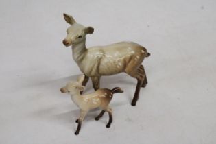 A BESWICK MODEL OF A DOE TOGETHER WITH A FAWN