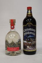 A 70 CL BOTTLE OF CLEMENTINE GIN LIQUEUR SNOW GLOBE TOGETHER WITH A 1L BOTTLE OF CHRISTKINDL