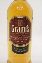 A 1 LITRE BOTTLE OF GRANTS BLENDED SCOTCH WHISKEY THE FAMILY RESERVE