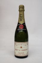 A BOTTLE OF PREMIERE CUVEE MOET & CHANDON CHAMPAGNE