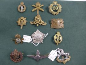A COLLECTION OF TWELVE MILITARY BADGES, TO INCLUDE PARACHUTE REGIMENT, MACHINE GUN CORPS ETC