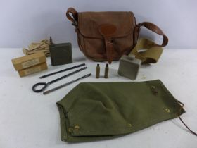 A SHOOTING CARTRIDGE BAG AND A 7.62MM CLEANING KIT