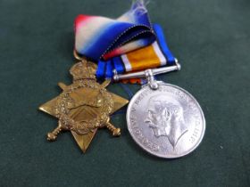 A WORLD WAR I 1914-15 STAR AND BRITISH WAR MEDAL AWARDED TO 84-18227 PRIVATE A E. BAKER ARMY SERVICE