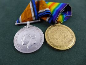 A WORLD WAR I MEDAL PAIR AWARDED TO 128262 PRIVATE W.G. ROBERTS MACHINE GUN CORPS.