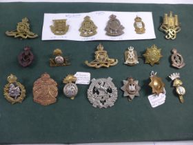 A COLLECTION OF NINETEEN MILITARY BADGES, TO INCLUDE ORDNANCE CORP, COLDSTREAM GUARDS ETC