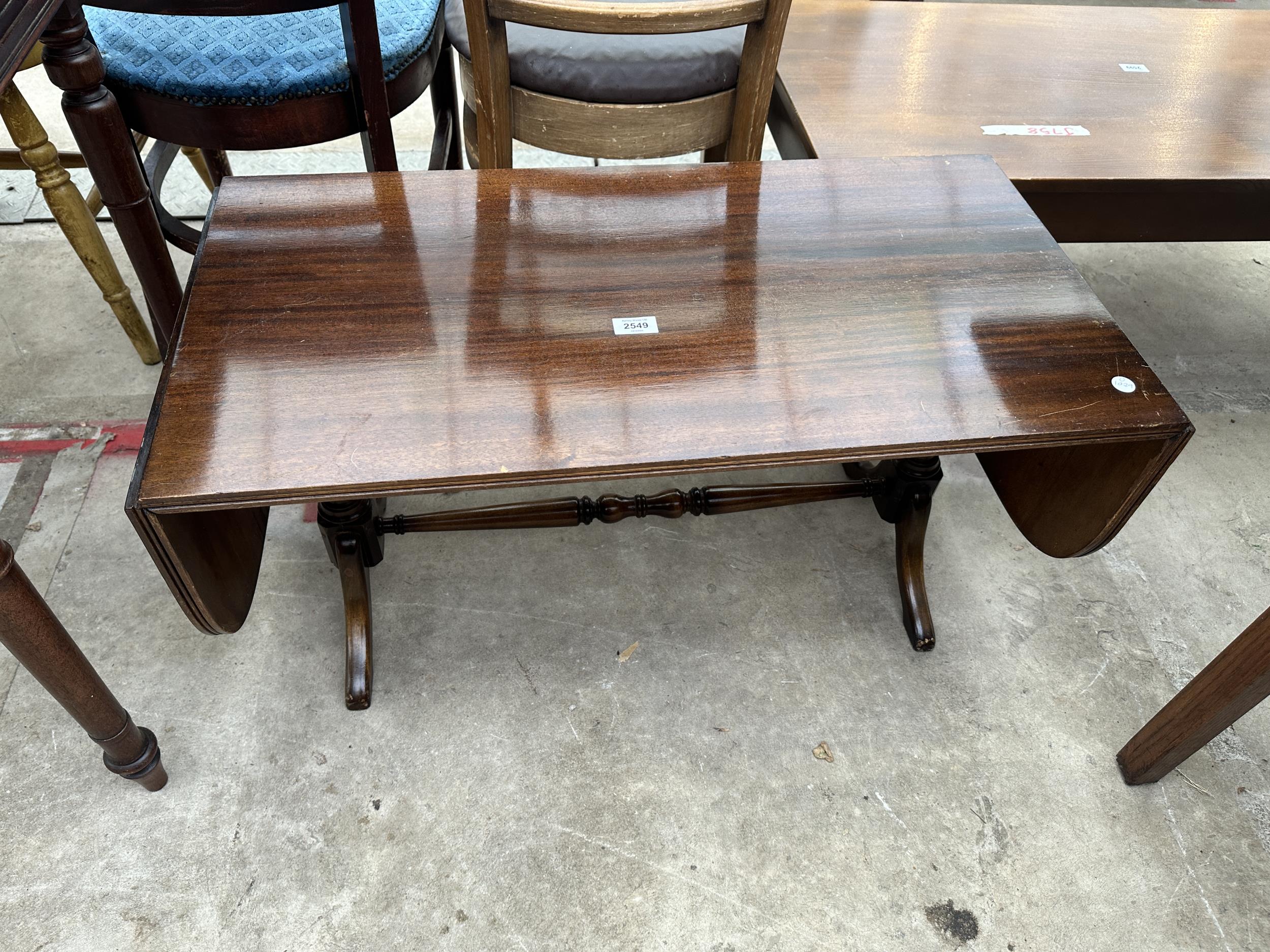 A MAHOGANY TWIN-PEDESTAL DROP-LEAF COFFEE TABLE