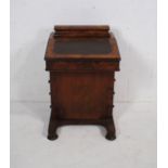 A Victorian inlaid walnut davenport, with four drawers, raised on turned flattened feet - missing