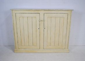 A painted pine two door cupboard - length 158cm, depth 36cm, height 122cm