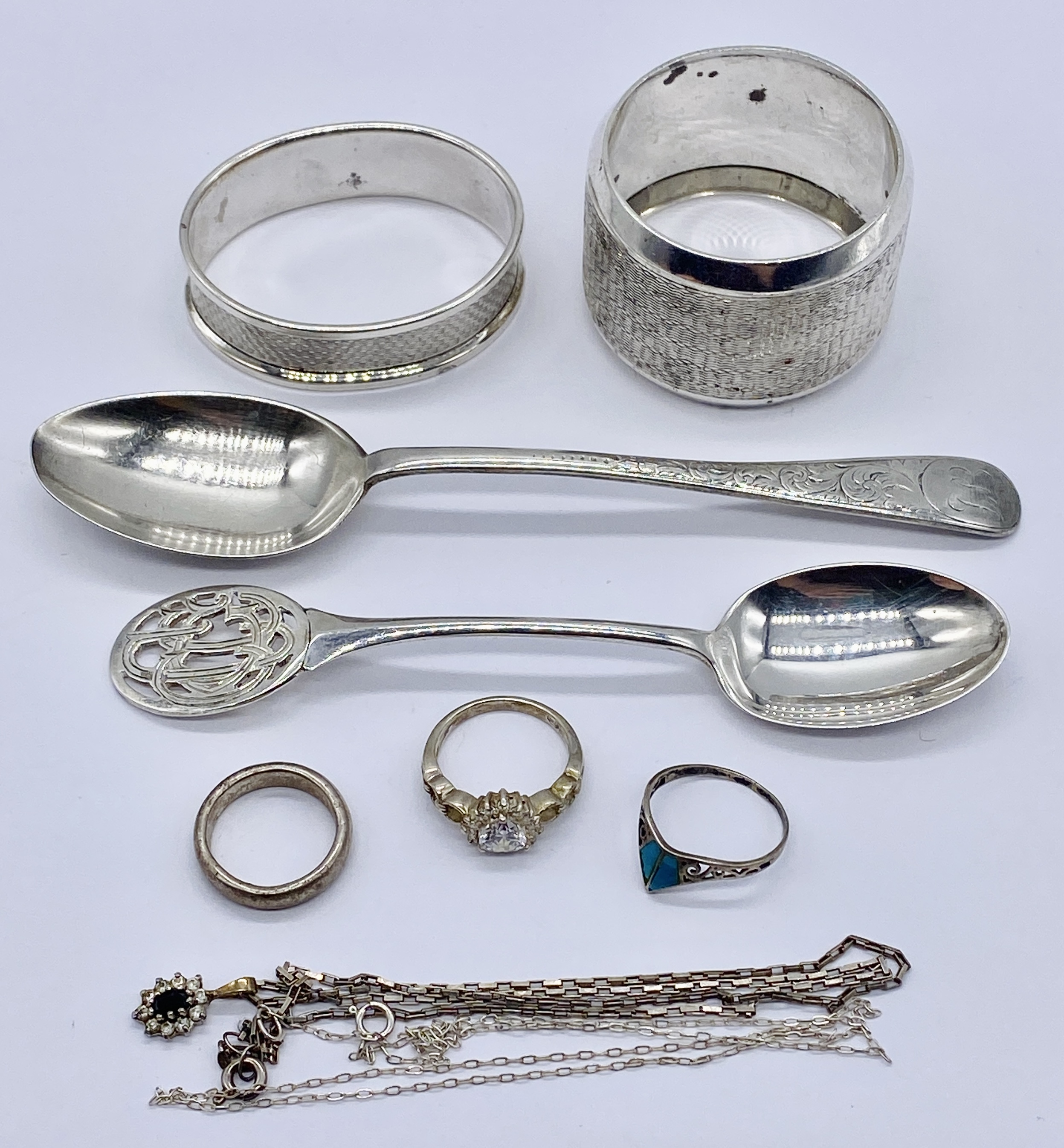 A small quantity of hallmarked silver items including jewellery, spoons and serviette rings