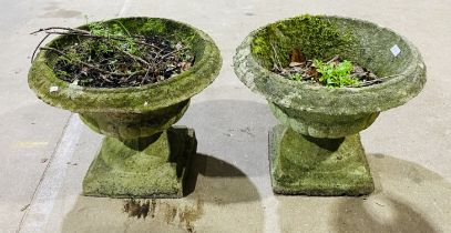 A pair of weathered garden urns, diameter 52cm
