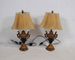 A pair of gilded Classical style table lamps