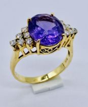 A 14ct gold ring set with an amethyst, size O