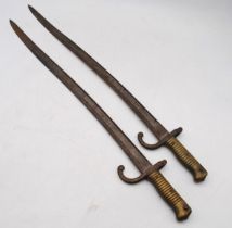 Two French Chassepot bayonets, with various impressed marks to the base of the blade, and indistinct