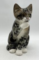 A Kensington pottery figure of a tabby cat designed by J Winstanley painted marks to base