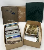 A large collection of vintage postcards including three partially completed albums