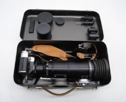 A vintage boxed Zenit Photo Sniper, with accessories including additional lens, filters and