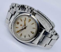 A vintage stainless steel Rolex Oyster Perpetual with arrow markers, original Rolex strap