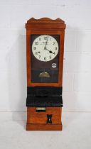 A Blick Time Recorder oak cased clocking in machine, with key and pendulum - length 34cm, depth