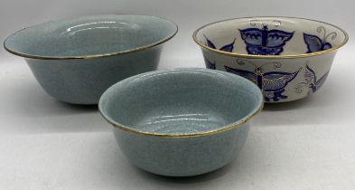 Three Oriental bowls, two Celadon bowls (largest 31cm diameter) and one other with character marks