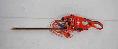 A Flymo EasiCut 600XT electric hedge trimmer