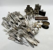 A collection of silver plated cutlery, napkin rings etc. along with a silver Coldstream Guards
