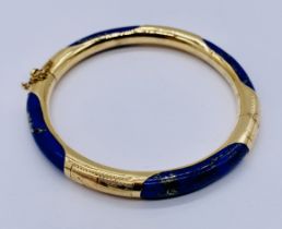 A 14ct gold and Lapis Lazuli hinged bangle