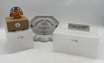 A small collection of name plaques for various manufacturers including a large Lomonosov plaque,