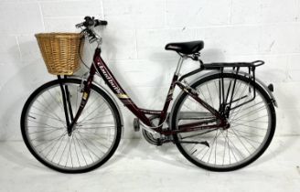 A Claud Butler ladies "Knightsbridge" bicycle with front basket and rear carrier. Measurement from