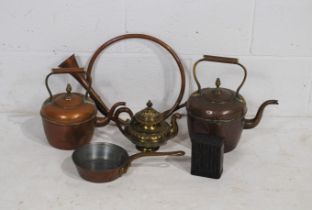 A quantity of brass and copper items, including two kettles, a bugle, a tea pot, skillet and a tin