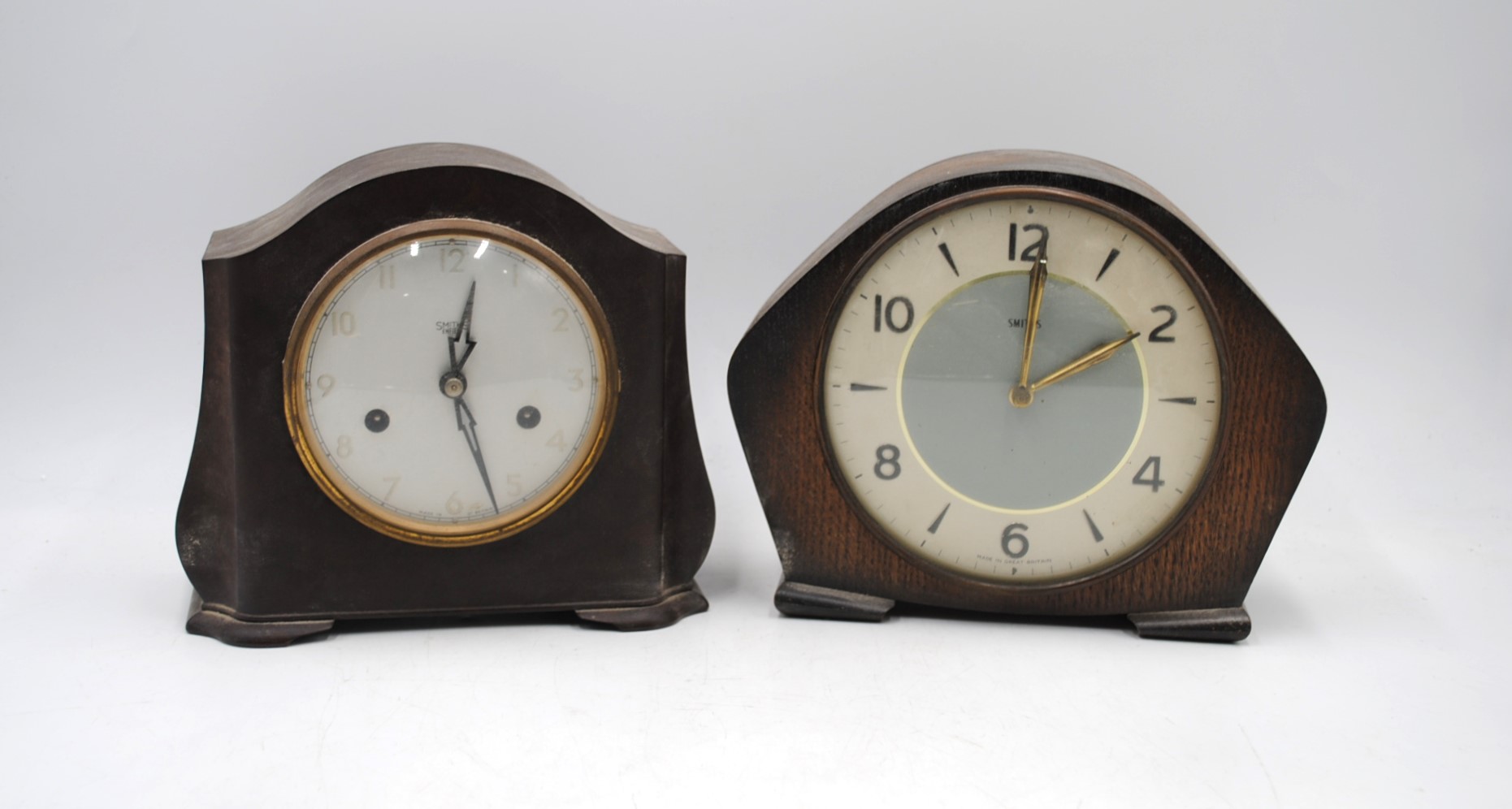 A vintage Smiths bakelite mantel clock along with a Smiths oak mantel clock