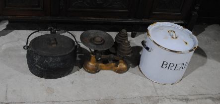 A vintage set of kitchen scales named to 'Matthews Bros' of Honiton, with weights, along with a cast