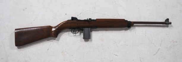A vintage Crossman .22 BB M1 Carbine air rifle, marked 'Crossman Arms Co Inc, Fairport, NY, USA',