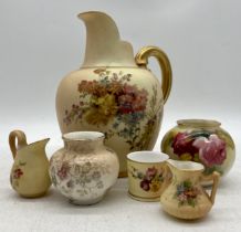 Five pieces of Royal Worcester including jugs (tallest 20 cm) miniature jugs, vases and cup, plus