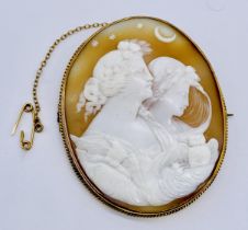 A large finely carved cameo set in unmarked 15ct gold, depicting Eos and Nyx, goddesses of night and