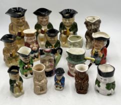 A large collection of various Toby jugs