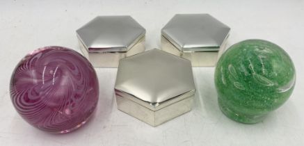 Three hexagonal silver coloured trinket boxes along with a Cowdy paperweight and one other