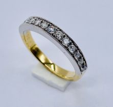 An 18ct gold half eternity ring set with diamonds, weight 3.3g, size K