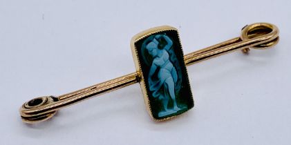 An antique unmarked gold (tested 9ct) brooch set with a small classical cameo of a lady