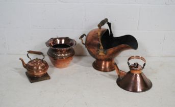 A quantity of copper items, comprising of a coal scuttle, two kettles and a spittoon