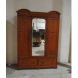 An Edwardian inlaid mahogany wardrobe, with mirrored door and two drawers, A/F - length 160cm, depth