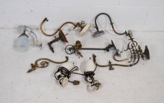 A quantity of various vintage metal wall light fittings, along with a pair of rise-and-fall