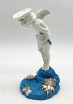 A Mintons figure of a cherub in nautical hat on blue and gilt base - 19cm height