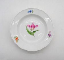 A Meissen plate, hand painted with tulips and other flowers - diameter 23cm