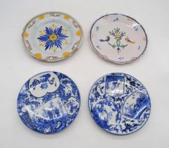 Two Continental tin glazed ceramic plates, along with two Oriental blue and white plates
