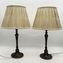 A pair of early 20th century chinoiserie table lamps with shades