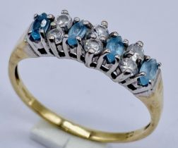 A 9ct gold dress ring set with topaz and CZ's, size P 1/2